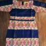 Dress in deep blue with patterned light bands