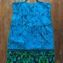 A very blue dress with black patterns and light greenish edging
