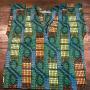 A blouse in mild green and blue colors but intriguing pattern