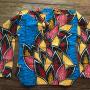 Blouse with leaves in many colors with a bright background